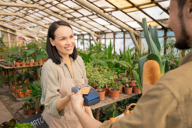 istock Friendly seller smiling to customer 1247828278