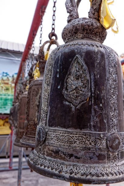 Steel Bell Hang in Wat Phanan Choeng temple Steel Bell Hang in Wat Phanan Choeng temple, Ayutthaya, UNESCO World Heritage Site, Thailand, Southeast Asia, Asia - 21st of Jnuary 2020 wat phananchoeng stock pictures, royalty-free photos & images