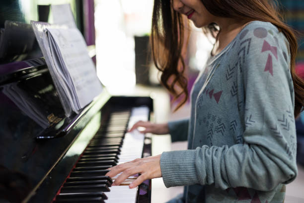 istock playing piano and stay home, covid-19 1247835207
