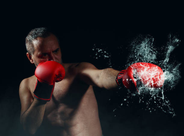 istock punching boxer and boxing gloves 1247836801