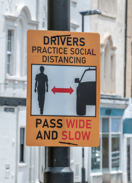 istock social distancing sign on a road in bath england 1247841154