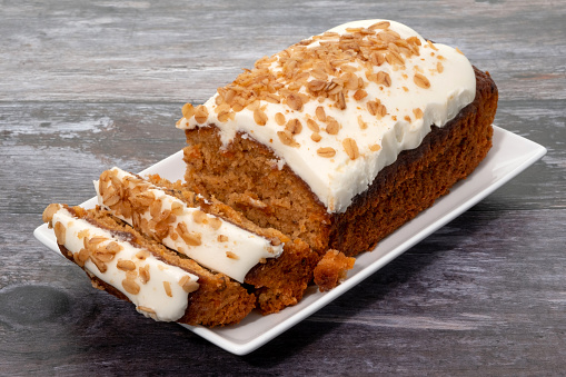 Carrot cake on a rustic wood background
