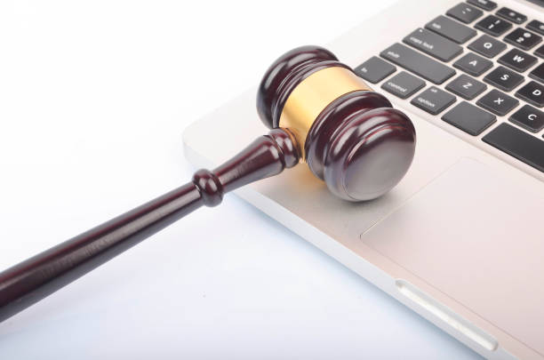 istock cyber crime concept. Gavel on laptop 1247858941