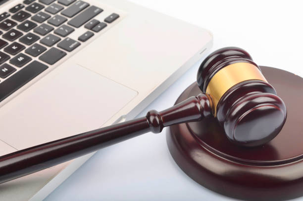 istock cyber crime concept. Gavel on laptop 1247858942