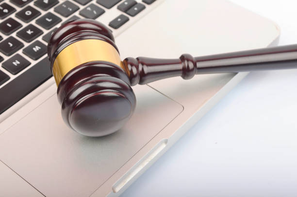 istock cyber crime concept. Gavel on laptop 1247858944