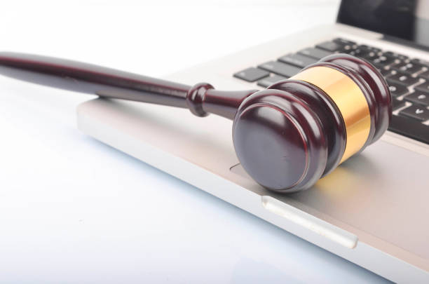 istock cyber crime concept. Gavel on laptop 1247858947