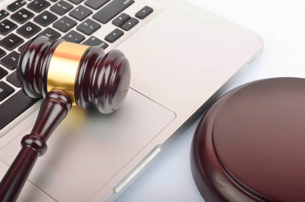istock cyber crime concept. Gavel on laptop 1247859284