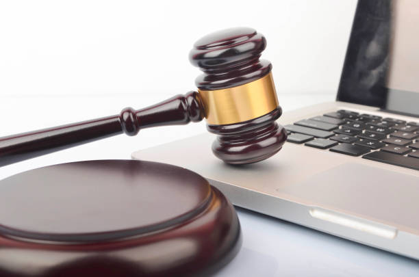 istock cyber crime concept. Gavel on laptop 1247859454