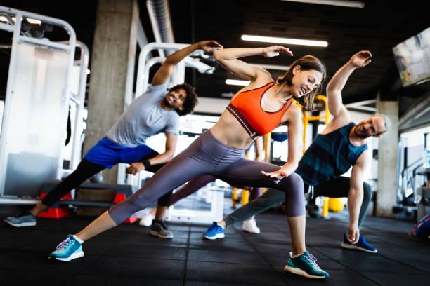 istock Beautiful fit people working out in gym together 1247864012