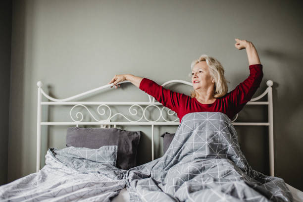 istock Senior woman waking up 1247875299