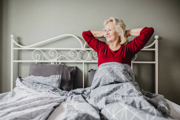 istock Senior woman waking up 1247875306