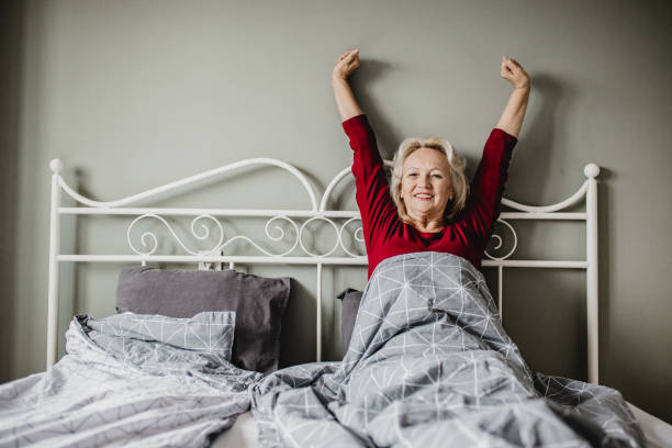 istock Senior woman waking up 1247875309