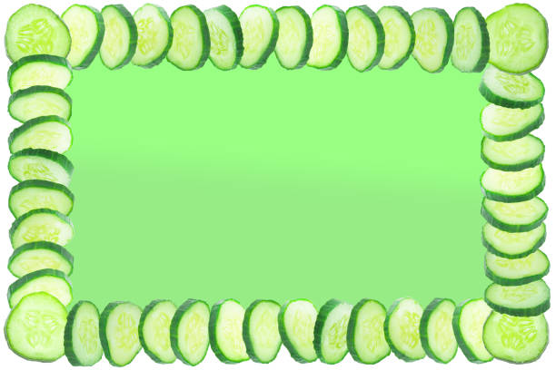 istock Background for text with frame of freshly sliced cucumbers. 1247876776