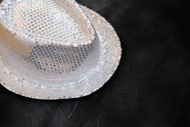 Silver sequin party hat. shiny party hat. party time concept. holiday selebration or night club concept. magicians accessories or festive equipment.