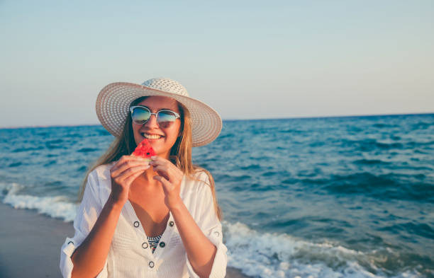 istock Eating and enjoying watermelon 1247884070