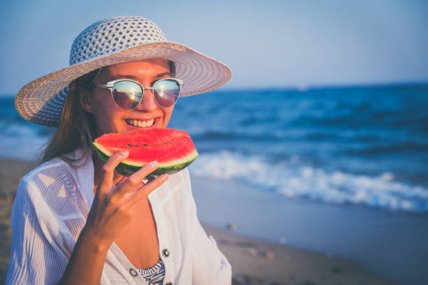 istock Eating and enjoying watermelon 1247884180