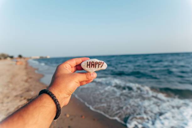 istock Man holding stone with text 