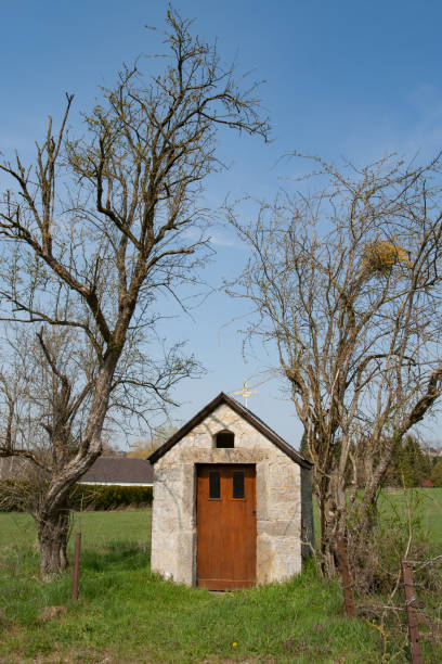 Small chapel between two trees stock photo