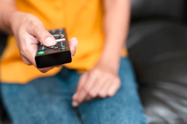 istock The hand is pressing the remote control to select the channel.Spend leisure time at home watching a movie. 1247888030