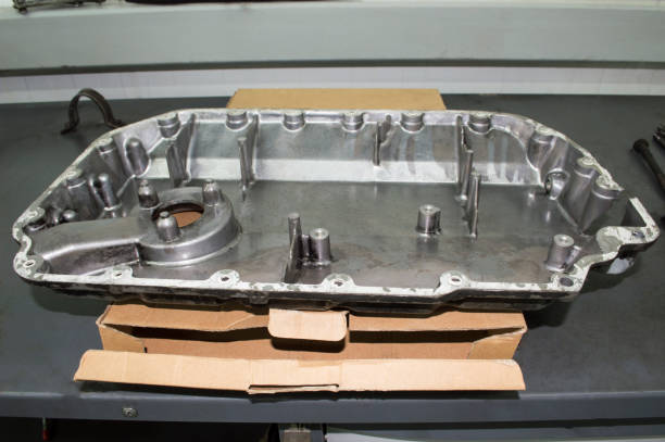 istock The oil sump of the internal combustion engine with a defect 1247888121