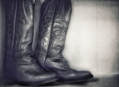Old fashioned photograph of cowboy boots