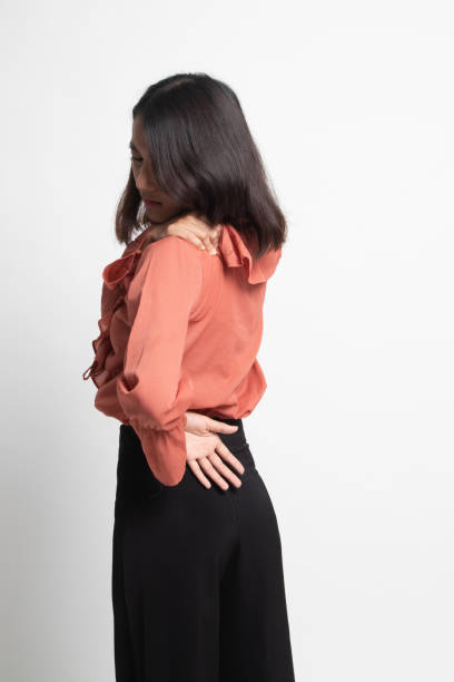 istock Young Asian woman got back pain . 1247893003