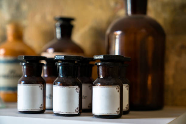 istock Group of small vintage translucent medicine bottles 1247898341