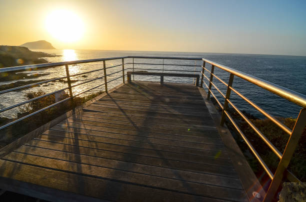 Sunrise Pier Sunrise on a Pier over Atlantic Ocean in Tenerife Canary Islands Spain 2632 stock pictures, royalty-free photos & images