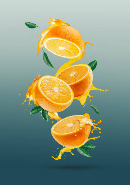 istock Orange slice juice splashes out from orange 1247899948