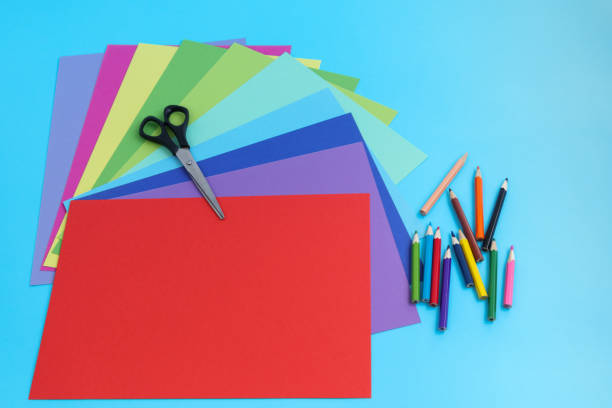 istock All for needlework, colored cardboard, pencils and scissors. On a light blue background. 1247902418