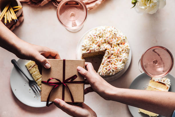 istock Woman receiving a birthday gift 1247903046