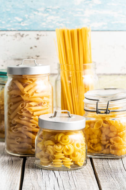 istock Various types of raw italian pasta in jars. 1247918948