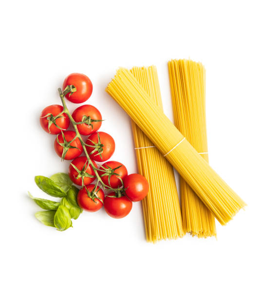 istock Raw spaghetti pasta, cherry tomatoes, basil leaves and olive oil. 1247918965