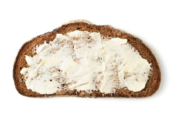 istock Slice of black bread with butter. 1247935333