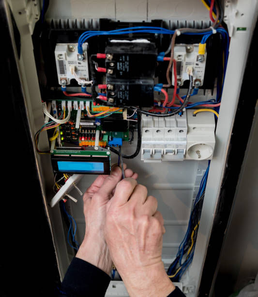 istock The man is repairing the switchboard voltage with automatic switches. 1247940238