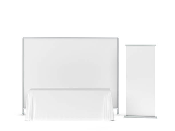 istock Blank tradeshow tablecloth with roll-up banners aside 1247940256