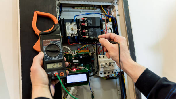 istock The man is repairing the switchboard voltage with automatic switches. 1247952967