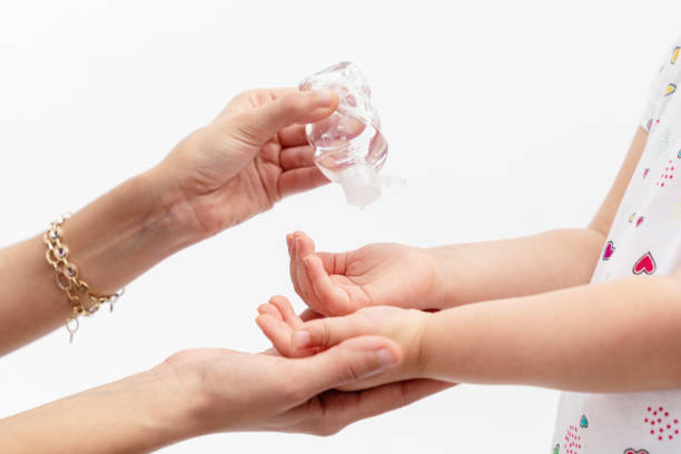 istock Personal hygiene, cleaning hands with disinfectany often to protect from virus. protecting child from illness. 1247962960