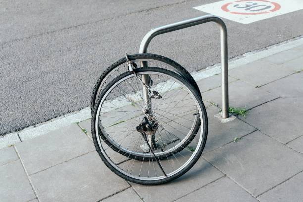 istock Bicycles stolen and left only wheels. Bicycle theft crimes concept 1247963137