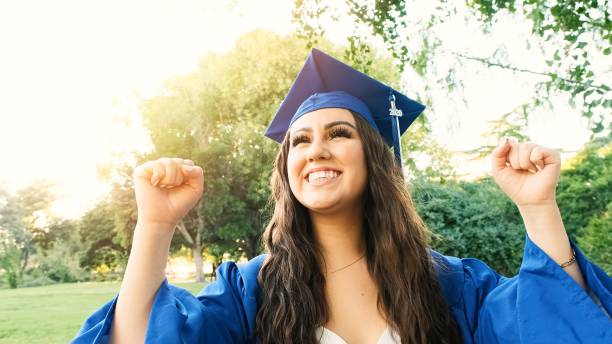 istock Cheering young woman celebrating her graduation 1247969688