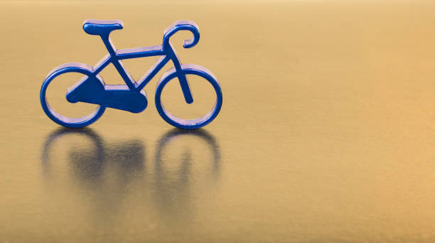 istock cycle sport miniature object soft focus simple poster concept wallpaper golden background surface with advertising empty copy space for your text here 1247969780