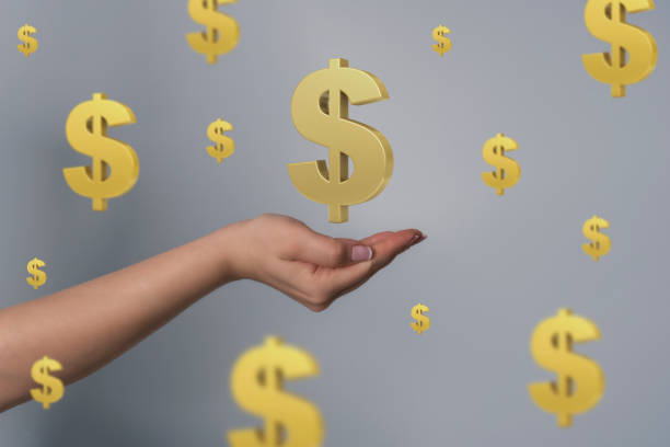 istock Hand holding gold dollars sign. 1247978226