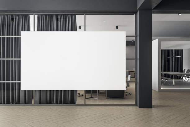 istock Futuristic coworking office interior with blank poster. 1247981027