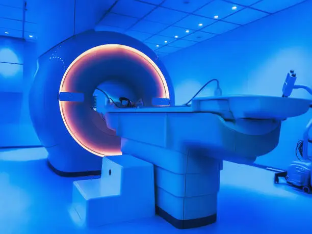 Photo of MRI - Magnetic resonance tomography imaging scan device in blue color