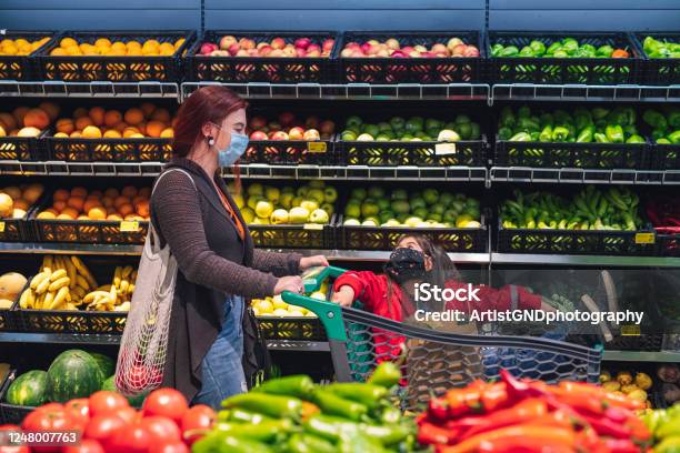 Asian Woman With Her Daughter Shopping In Supermarket With Face Protective Mask Stock Photo - Download Image Now
