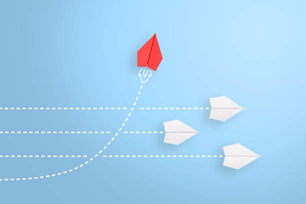 istock Change concepts with red paper airplane leading among white 1248011917