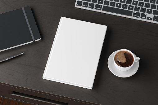 Book cover mock up. Workspace on wooden desk with cup of coffee