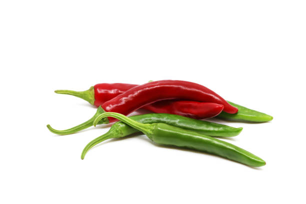 istock Red pepper and green pepper isolated in white background 1248043297