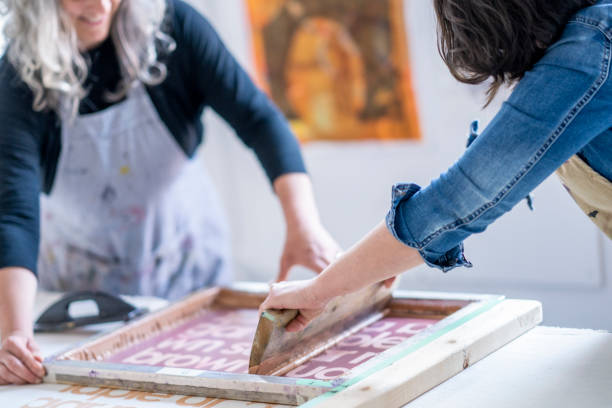 istock Two female artists screen printing fabric 1248049709