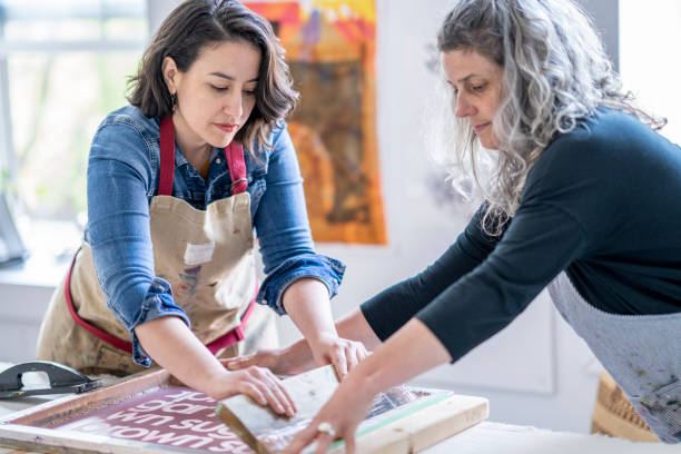 istock Two female artists screen printing fabric 1248049719